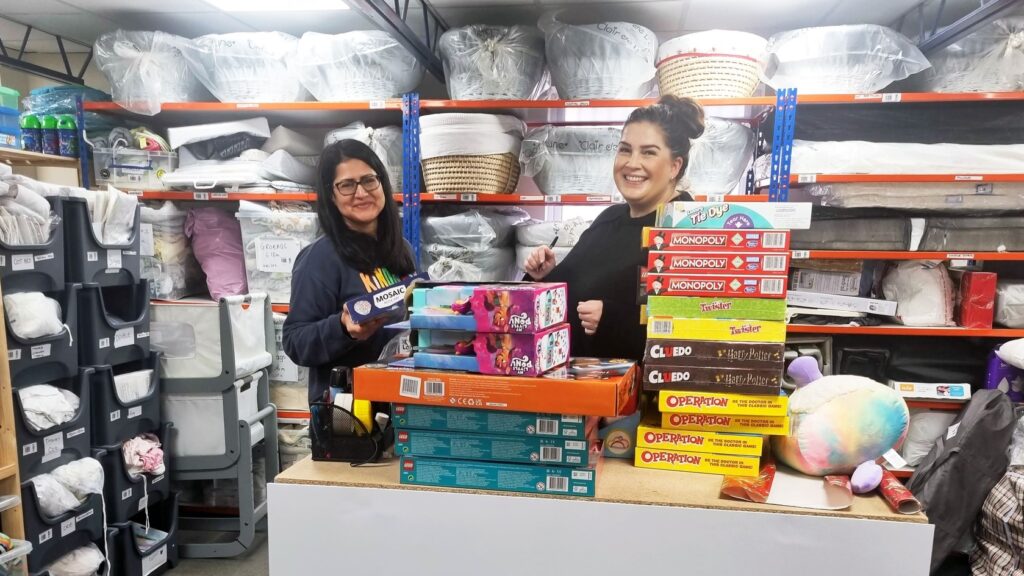 Two volunteers at a baby bank.