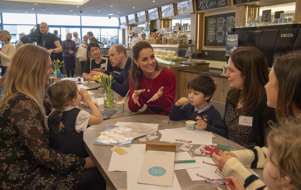 The Princess of Wales in a coffee shop with parents and children.